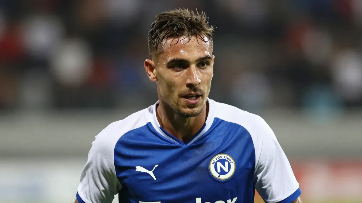 Gent leads with 12 points from 4 games after Tiago Araujo's goal against OH Leuven, as Balikwisha sees title chances